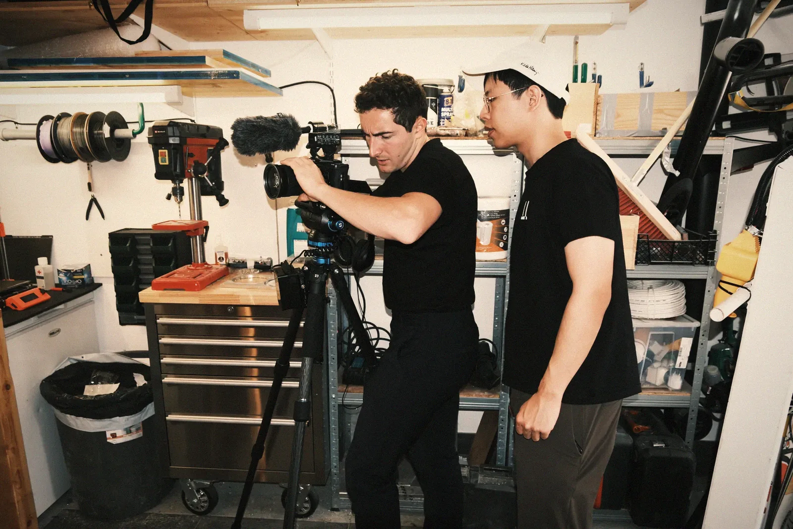 Two coprod founders filming in the workshop